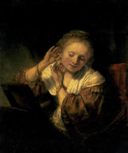 Rembrandt - Young Woman Trying Earrings, 1654