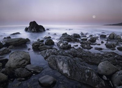 Tim Fitzharris - Full moon over boulders at El Pescador State Beach, Malibu, California