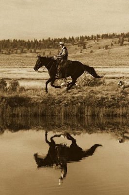 Konrad Wothe - Cowboy riding Horse beside pond with two dogs, Oregon - Sepia