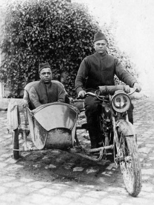 Unknown 20th Century Photographer - Two unidentified African American soldiers in uniforms and overseas caps on motorcycle with sidecar, ca. 1917