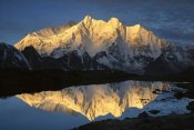 Colin Monteath - Mt Makalu and Mt Chomolonzo bathed in dawn light, reflected in small lake, Khama Valley, Tibet