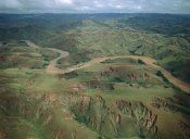 Konrad Wothe - Deforested and eroded hills along silted Betsiboka River, Madagascar