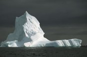 Colin Monteath - Grounded iceberg with storm clouds overhead, Pleneau Island, Antarctica