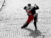 Anonymous - Couple dancing Tango on cobblestone road