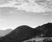 Ansel Adams - View of hill with trees, clouded sky, in Rocky Mountain National Park, Colorado, ca. 1941-1942