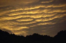 Simon Cox - Cumulonimbus clouds at dawn above Norwest Arch, Ben Ohau Range, Southern Alps, New Zealand