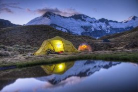 Colin Monteath - Campers read in tents lit by flashlight, Cascade Saddle, Mount Aspiring National Park, New Zealand