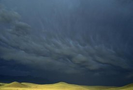 Gerry Ellis - Storm clouds over hills, Grasslands National Park, Canada