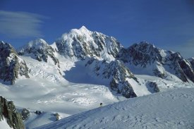 Colin Monteath - Ski mountaineer near summit with Mt Tasman behind, Westland NP, New Zealand