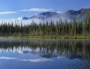 Tim Fitzharris - Lake reflecting mountain range and forest, Kluane National Park, Yukon, Canada