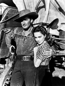 Hollywood Photo Archive - Errol Flynn with Ann Sherdian in Dodge City