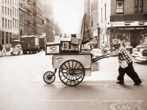 Angelo Rizzuto - Vendor pushing food cart at the end of the day, New York City, 1957