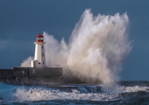 Pangea Images - Lighthouse in raging Sea