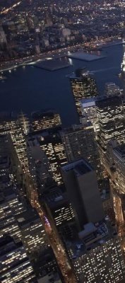 Cameron Davidson - Night aerial view of the Financial District, NYC (left)