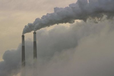 Gerry Ellis - Gas effluence pouring out of smoke stacks at nuclear power plant, upper Ohio River, Ohio