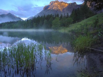 Tim Fitzharris - Morning light on Mt Kidd, mist rising from water, Kananaskis Country, Alberta, Canada