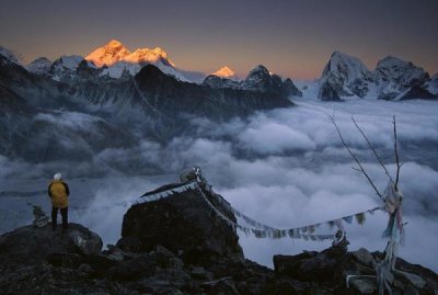 Colin Monteath - Mountaineer enjoying the view of Mt Everest and the Himalayan Mountains at sunset from Gokyo Ri, Khumbu, Nepal