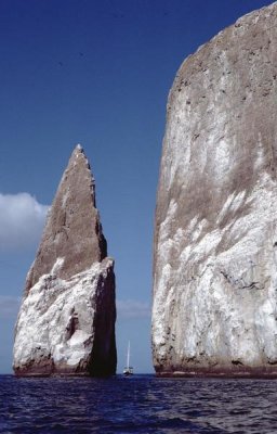 Tui De Roy - Kicker Rock tufa formation with sailboat, Galapagos Islands, Ecuador