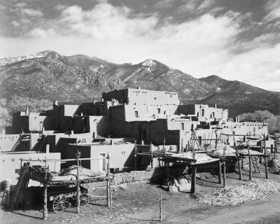 Ansel Adams - Full view of city, mountains in background, Taos Pueblo National Historic Landmark, New Mexico, 1941