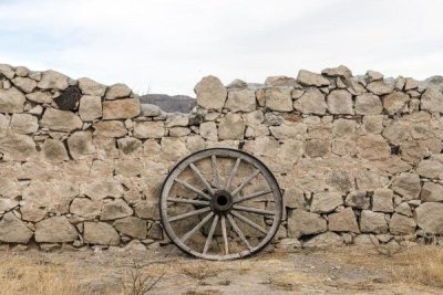 Carol Highsmith - Wagon wheel against a stone fence at Hueco Tanks State Park, northwest of El Paso, TX