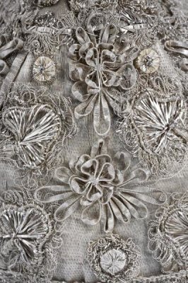 Unknown Swedish Needleworker - Detail of elaborate silver embroidery on a child's bonnet