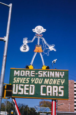 John Margolies - More Skinny Used Car sign, Santa Fe Avenue, Pueblo, Colorado