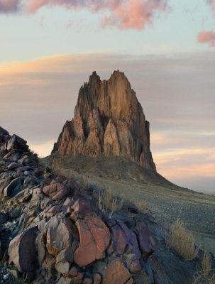 Tim Fitzharris - Rock formation at sunset,remenant basalt core of extict volcano, Ship Rock, New Mexico