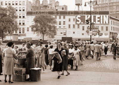 Angelo Rizzuto - Pretzel vendor among pedestrians Broadway, E. 14th St., New York City, 1953