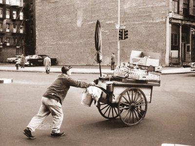 Angelo Rizzuto - Man pushing food cart at the end of the day, New York City, 1957