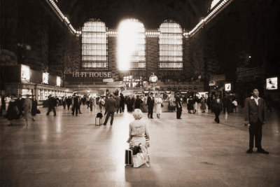 Angelo Rizzuto - Woman and child resting on luggage in Grand Central Terminal, New York City, 1958